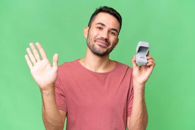 Young handsome man over isolated background