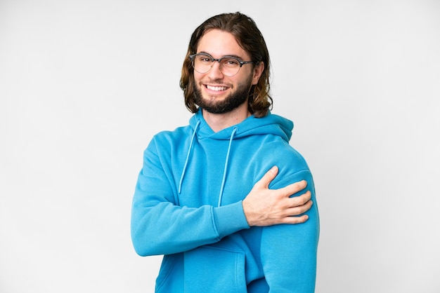 Young handsome man over isolated white background laughing