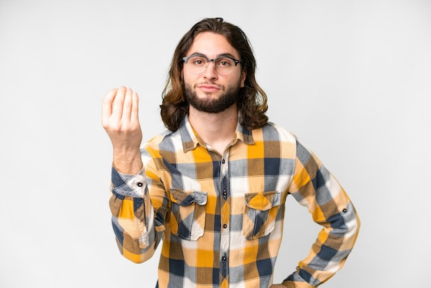 Young handsome man over isolated white background making Italian gesture