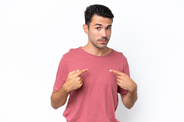 Young handsome man over isolated white background pointing to oneself