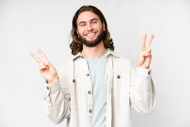 Young handsome man over isolated white background showing victory sign with both hands