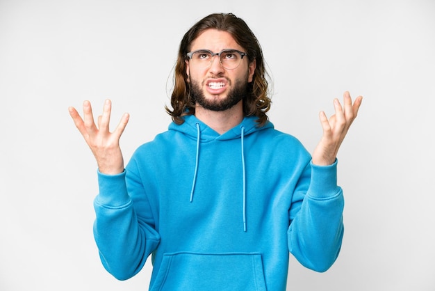 Young handsome man over isolated white background stressed overwhelmed