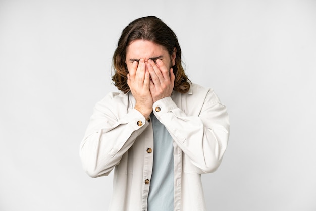 Young handsome man over isolated white background with tired and sick expression