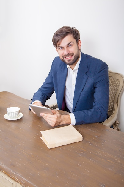 young handsome man sitting at work