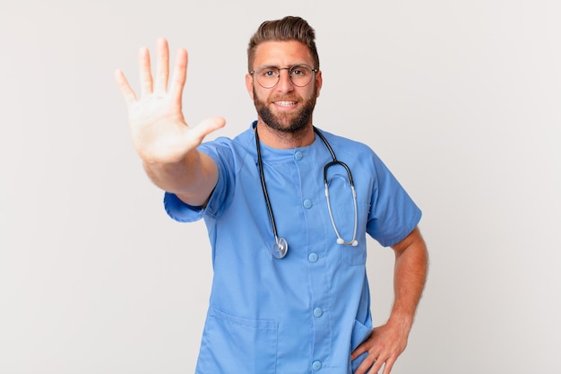 Young handsome man smiling and looking friendly, showing number five. nurse concept