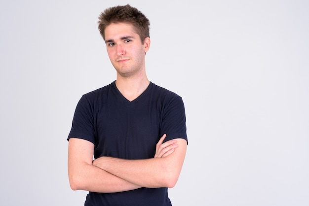 Young handsome man with arms crossed