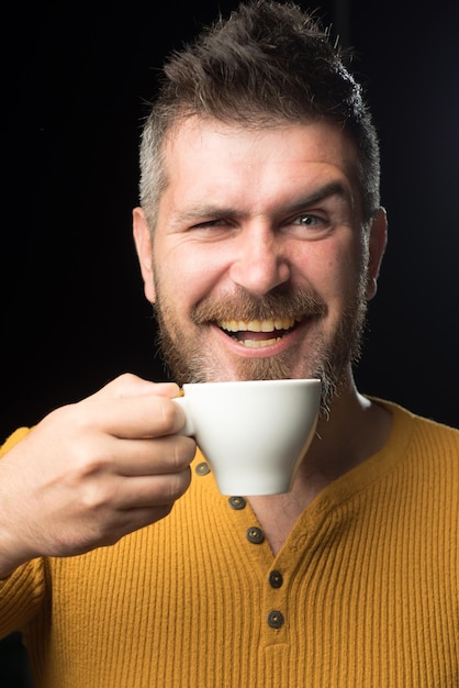 Young handsome man with brunette hair over isolated background painful expression because of toothac