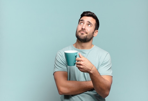 Young handsome man with a coffee cup