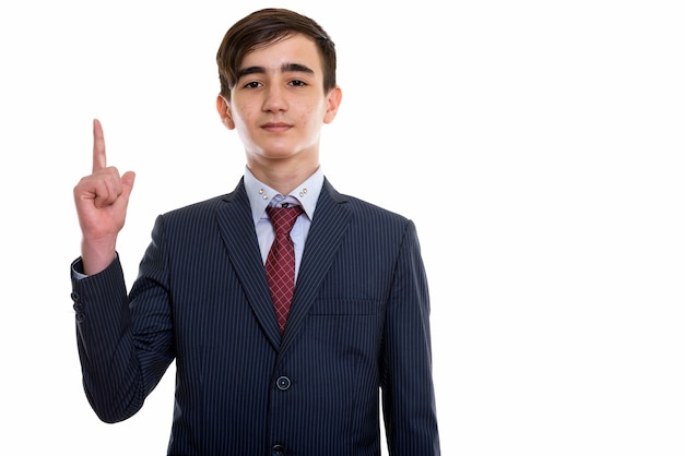 young handsome Persian teenage businessman pointing up