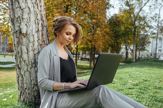 Young happy business woman with laptop