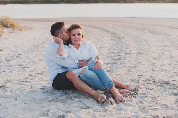 Young happy couple on the beach