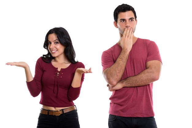 young happy couple smiling with woman shrugging