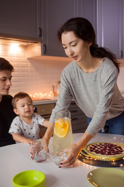 Young happy family for a festive dinner.