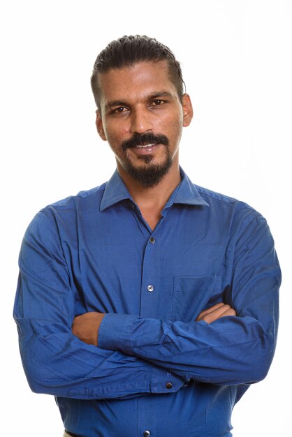 Young happy Indian businessman smiling