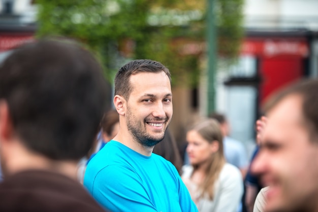 Young happy man on the street