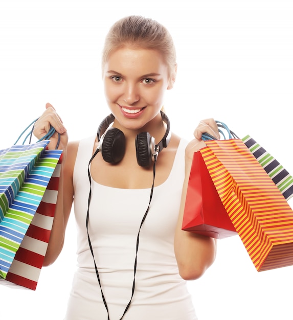 Young happy smiling woman with shopping bags