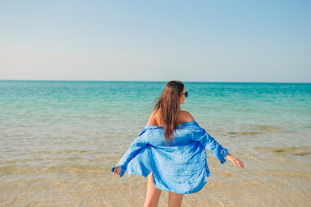 Young happy woman on the beach