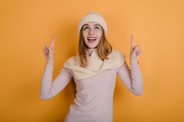 Young happy woman gesturing with finger make up, feels excited with good idea reach inspiration motivation.