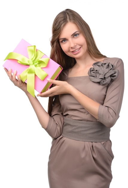 Young, happy woman holds a box with a gift.