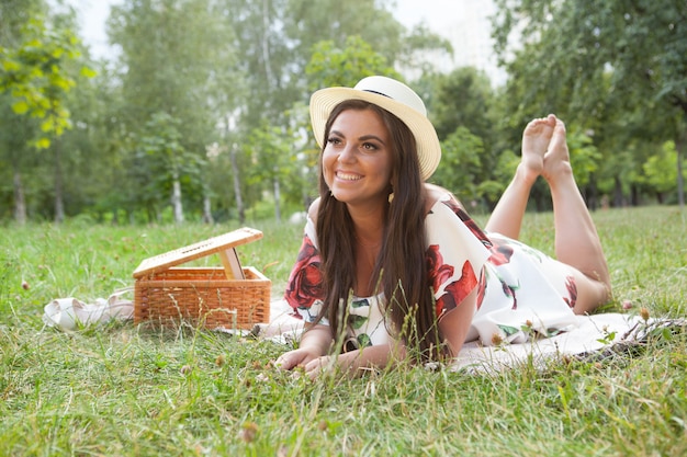 Young happy woman at a picnic