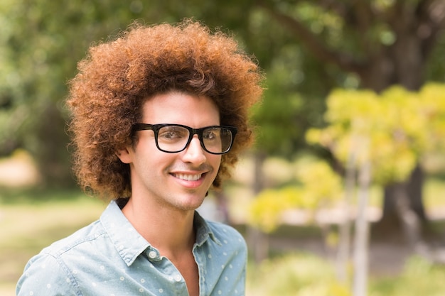 Young hipster smiling at camera