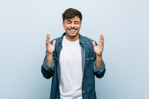 Young hispanic cool man joyful laughing a lot. 