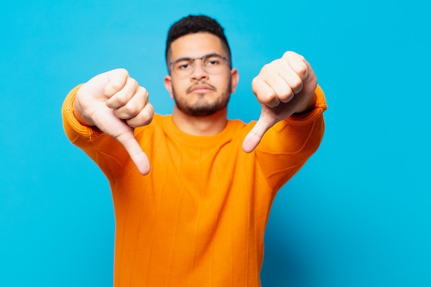 Young hispanic man angry expression