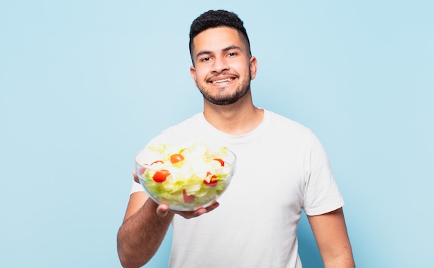 Young hispanic man happy expression. dieting concept