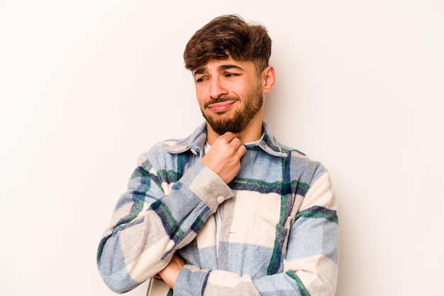 Young hispanic man isolated on white background suffers pain in throat due a virus or infection