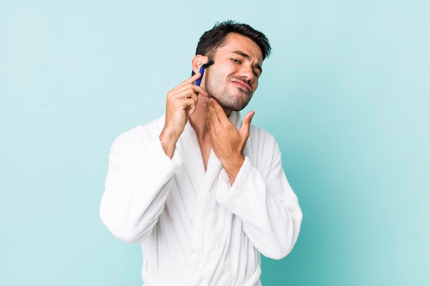 Young hispanic man shaving concept