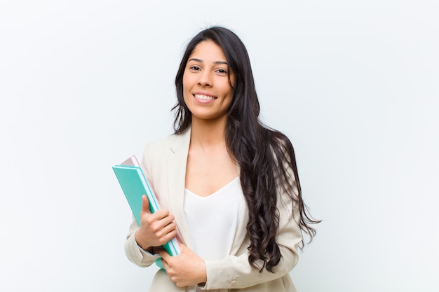 Young hispanic pretty woman with a book