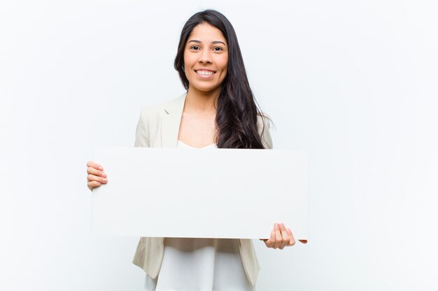 Young hispanic pretty woman with a placard