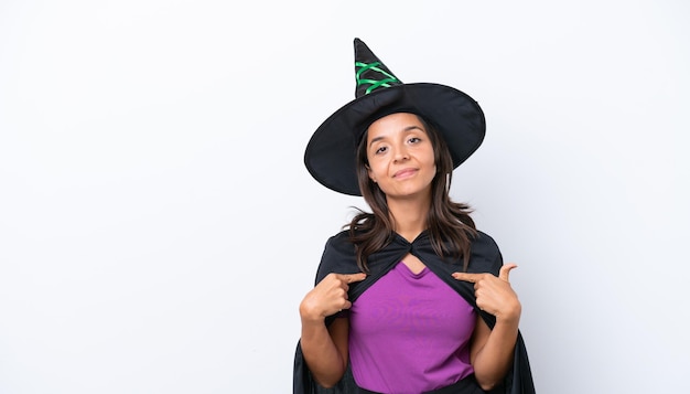 Young hispanic woman dressed as witch over isolated background proud and selfsatisfied