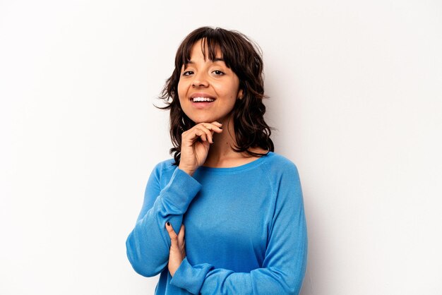 Young hispanic woman isolated on white background smiling happy and confident touching chin with hand