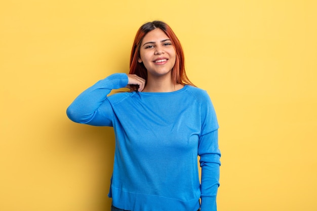 Young hispanic woman laughing cheerfully and confidently with a casual happy friendly smile