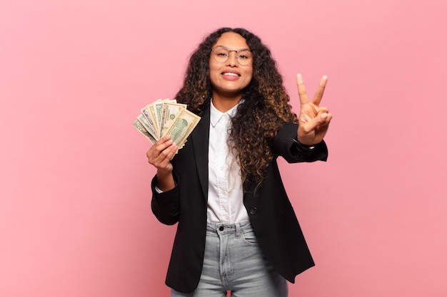 Young hispanic woman smiling and looking friendly