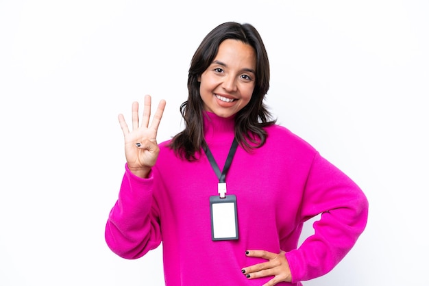 Young hispanic woman with ID card isolated on white background happy and counting four with fingers