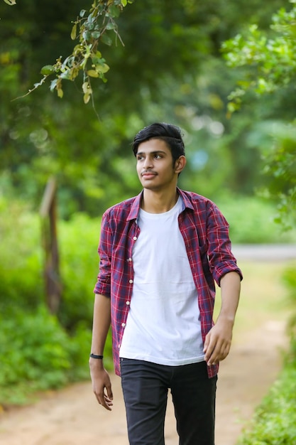 Young indian college student showing expression.