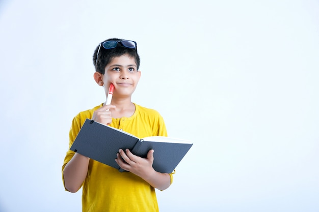 Young indian cute boy with notebook