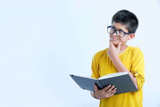 Young indian cute boy with notebook