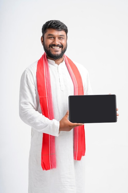 Young indian farmer showing note pad on white background