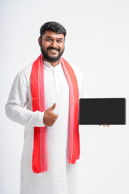 Young indian farmer showing note pad on white background