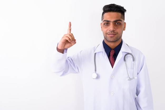 Young Indian man doctor on white