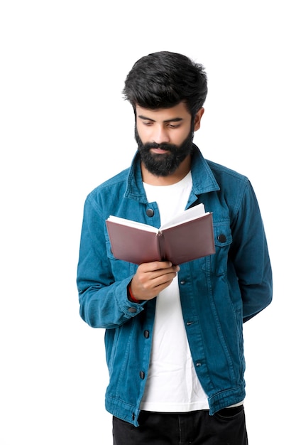 Young Indian man holding dairy in hand on white background