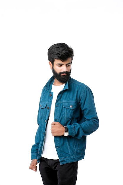 Young indian man wear jacket and giving expression over white background