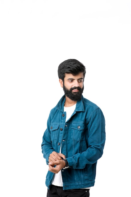 Young indian man wear jacket and giving expression over white background