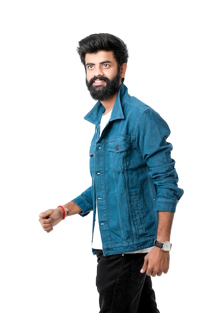 Young indian man wear jacket and giving expression over white background