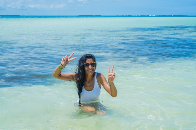 Young indian woman happy in the beach