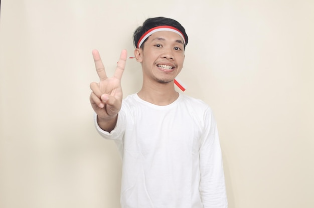 Young Indonesian men celebrate independence day with happy expressions