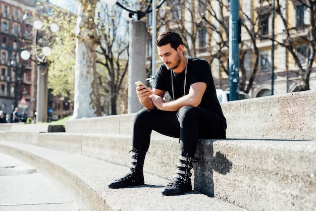 Young italian boy using smartphone